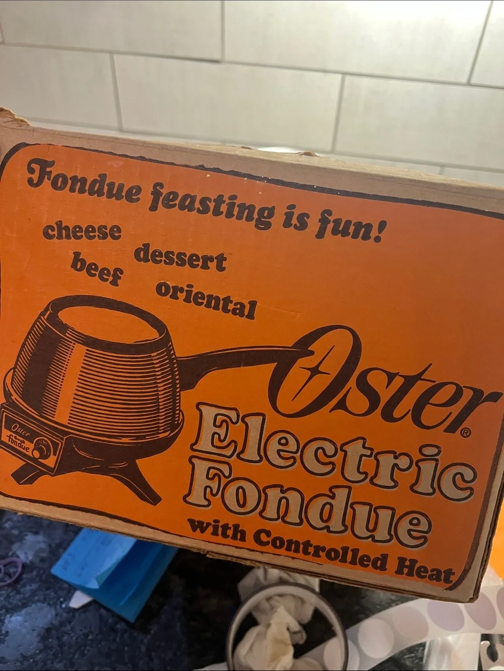 Vintage Oster MCM Harvest Gold Electric Fondue Set with Black Lid and Handle.